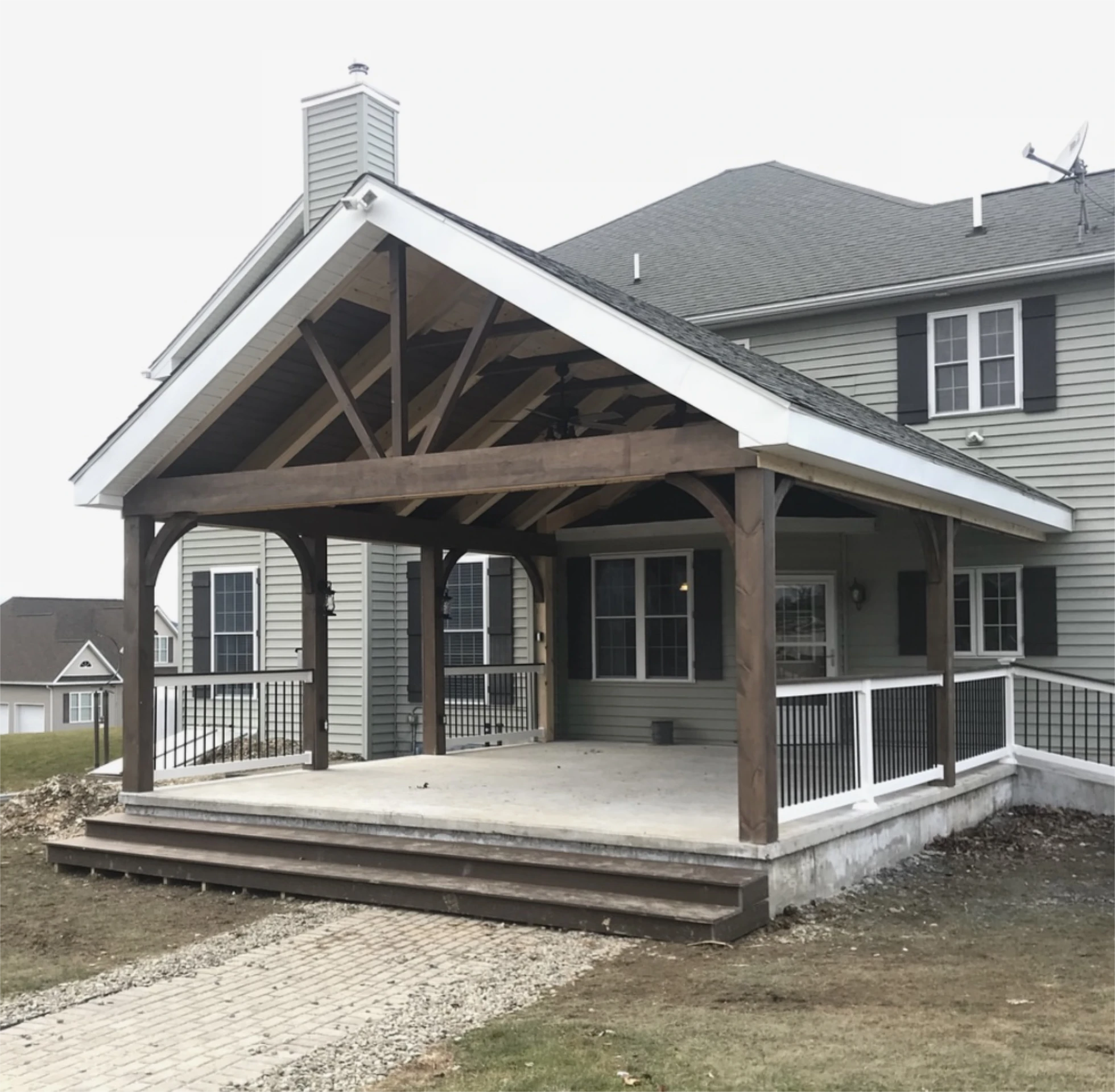 Covered backyard patio with timber frame gable roof